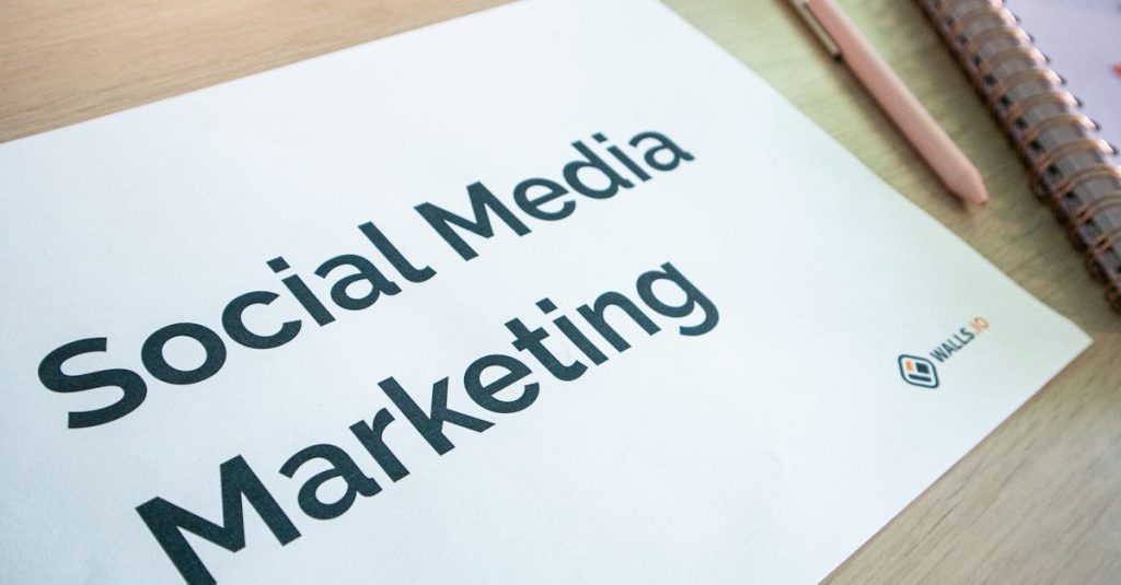 Close-up of a social media marketing document on a desk with a pen and notebook.